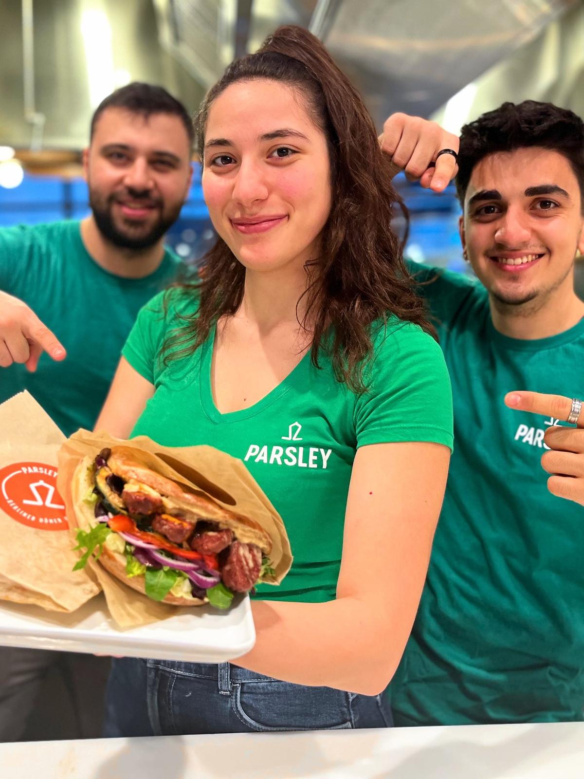 The Parsley team smiling behind the counter with fresh dürüms