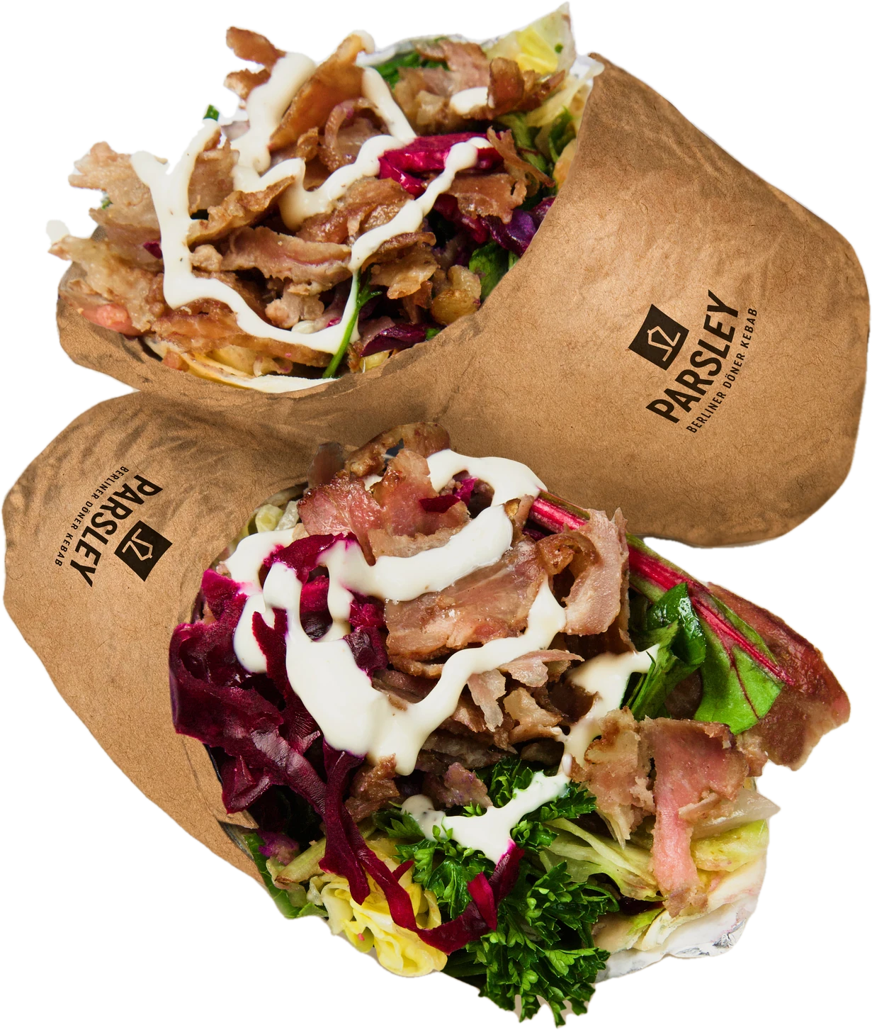 Two döner dürüms in Parsley kraft wraps with garlic sauce, red cabbage and fresh greens