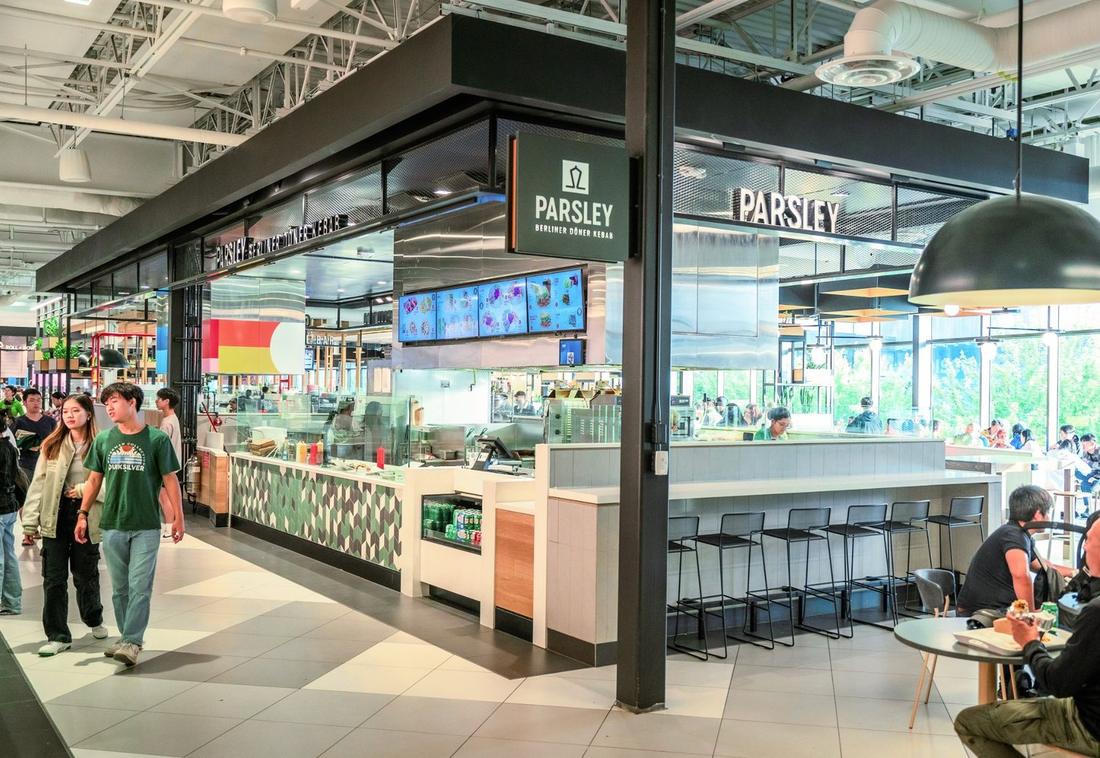 The Parsley counter in The Amazing Brentwood food court, with seating and guests eating